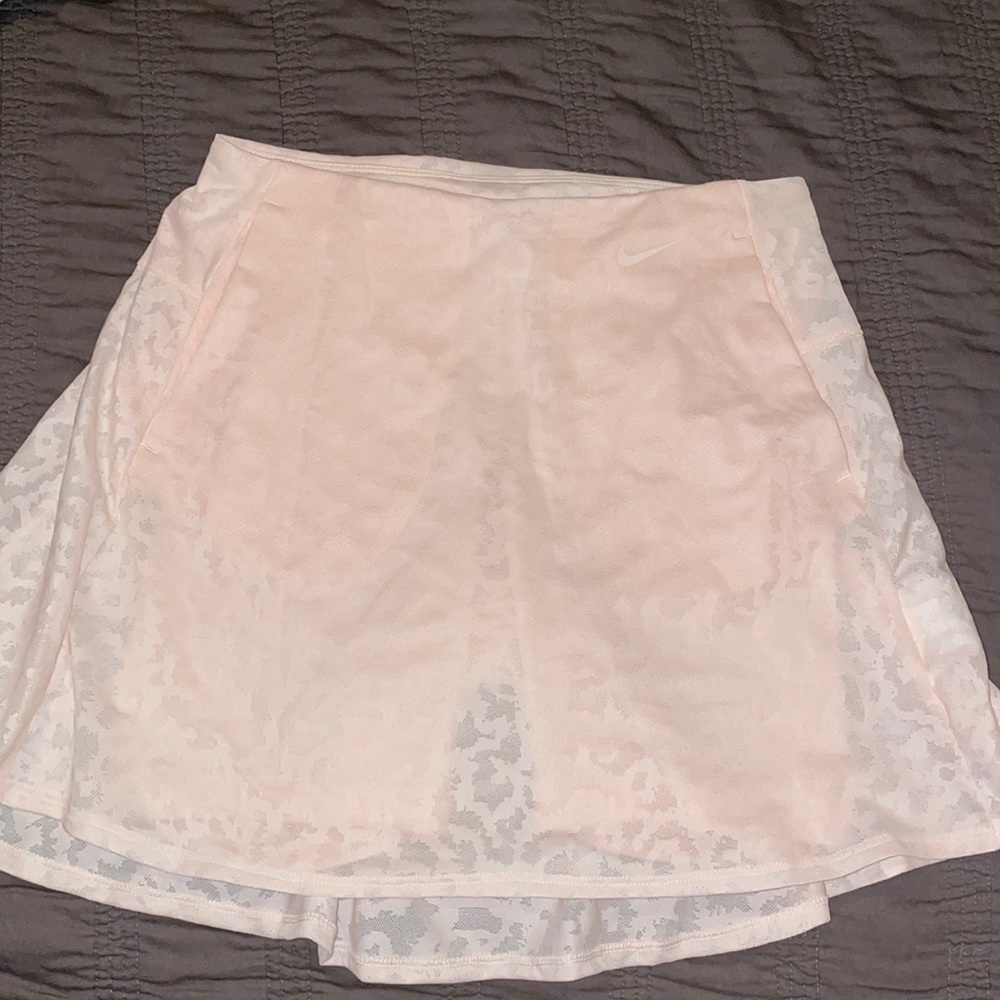 Brand new Nike athletic pink skirt with pockets and shorts lined